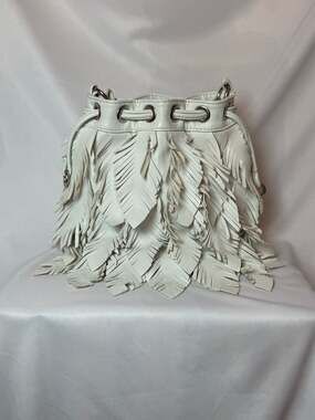 CHI by Carlos Falchi "Leaves" bucket handbag is made of genuine, high-quality le